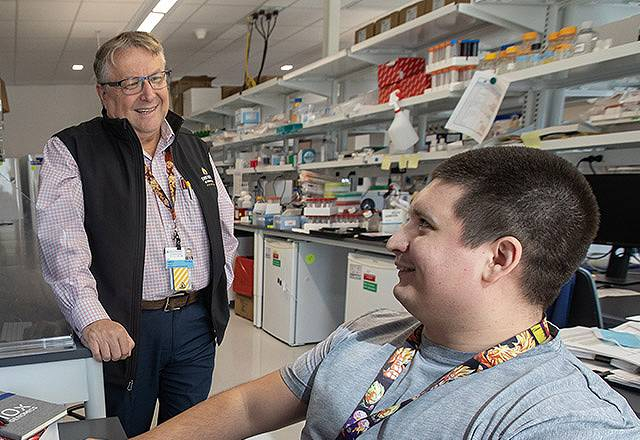 Laszlo Nagy, M.D., Ph.D. (center), and Laszlo Halasz, Ph.D. in the Nagy Lab in the Institute for Fundamental Biomedical Research at Johns Hopkins All Children's